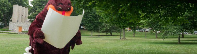 The hokie bird is lost and looking at a map.